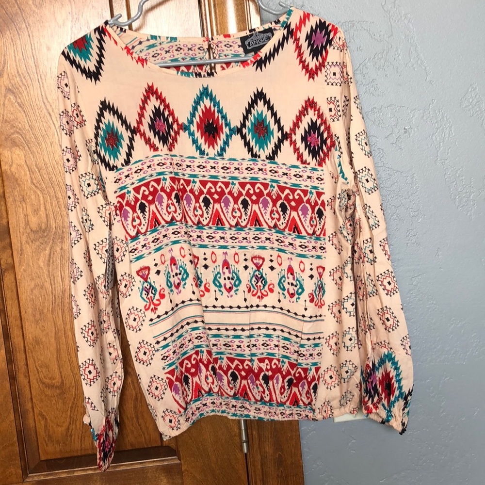 Women’s large slit arm top from local boutique.